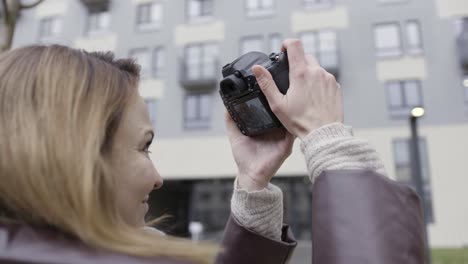 woman taking photo of a building