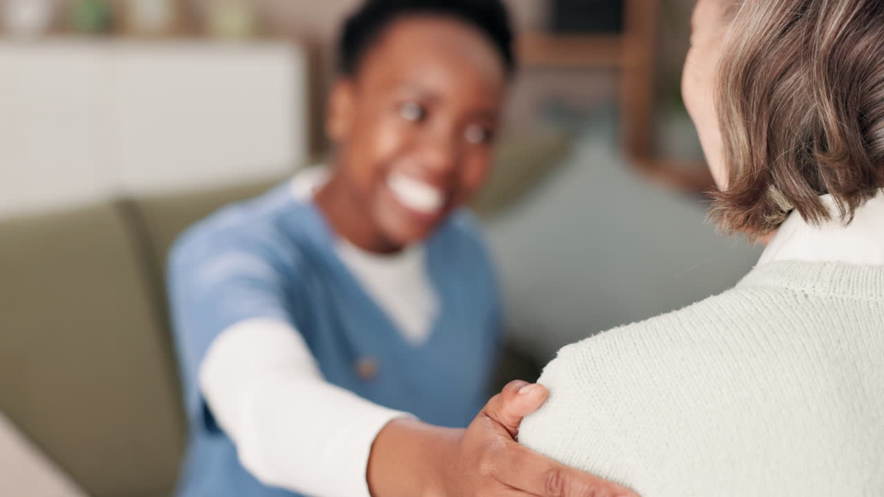 Nurse supporting elderly patient
