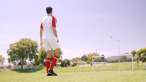 football player kicking the ball