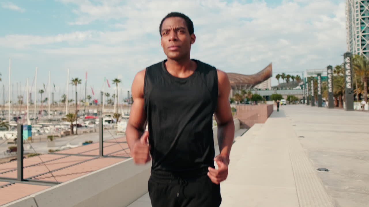 Man Jogging on Boardwalk by Marina