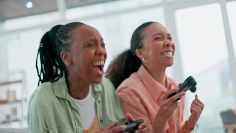 Friends,-video-game-and-women-on-sofa-playing