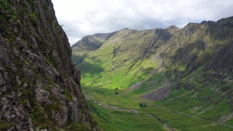 Dramatic-Aerial-Shot-Revealing-Glencoe-valley-In-The-Scottish-Highlands,-Scotland,-UK