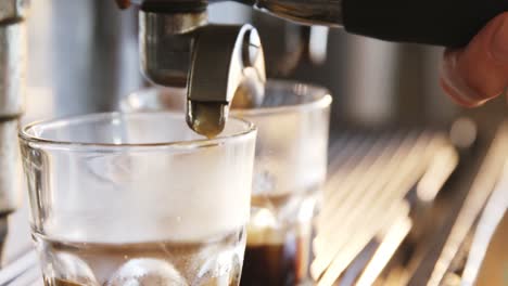 Close-up-of-espresso-pouring-from-coffee-machine