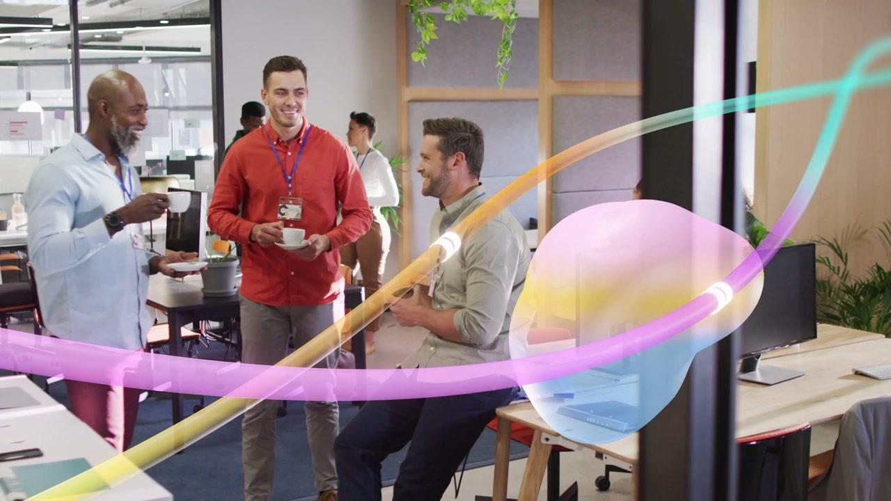 Office team on coffee break coworker gesturing ribbon and 3D blob sweeping past sparking laughter