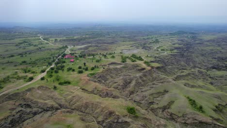 Embark-on-a-mesmerizing-aerial-adventure-through-the-otherworldly-landscapes-of-Tatacoa-Grey-Desert,-where-nature-unveils-its-raw-and-captivating-beauty