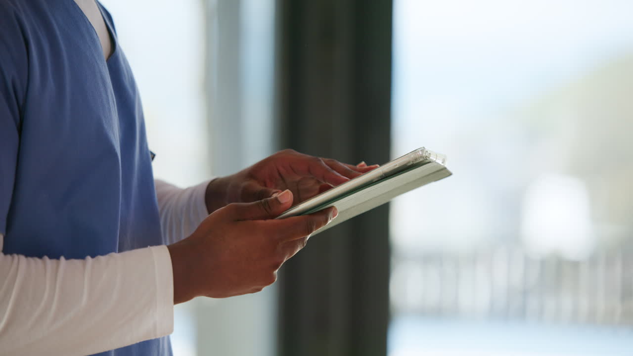 Healthcare Professional Using Digital Tablet in a Medical Setting