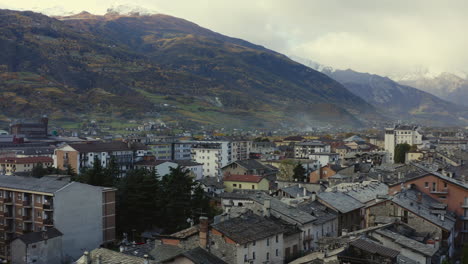 a majestic look of the valle d’aosta, italy, with amazing clave of mountains, and rooftops, drone view