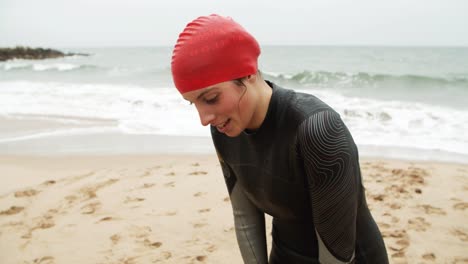 happy female swimmer on beach