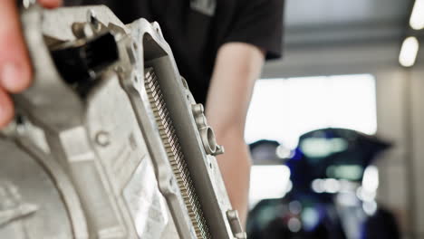 automotive mechanic working on engine components