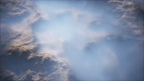 distant mountain range and thin layer of fog on the valleys