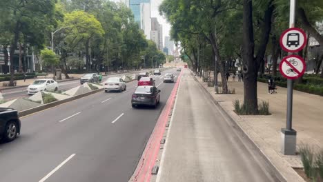 slow motion shot of heavy traffic in reforma avenue mexico city