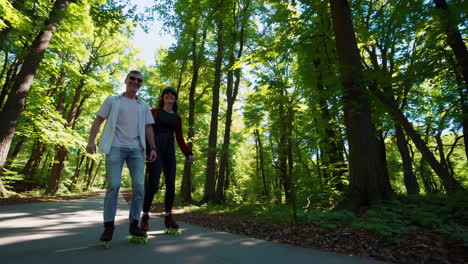 couple roller skating in a forest