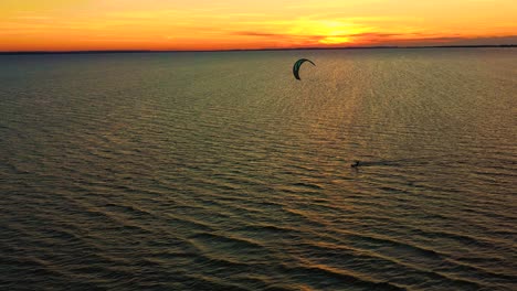 aerial view. kite surfing on the blue sea in the background of beautiful clouds. sunset