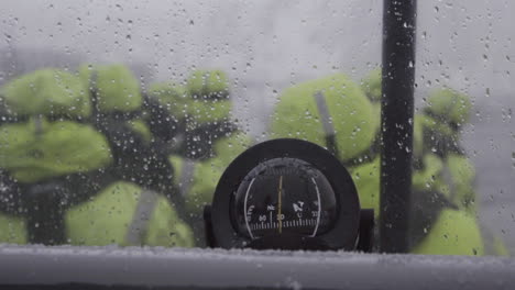 explorer manual compass on a sailing boat at norway