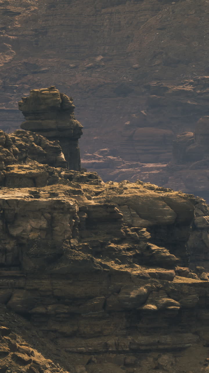 Desolate rocky landscape under dramatic sunlight in a remote location