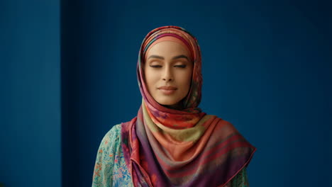 portrait of a young woman in a colorful hijab