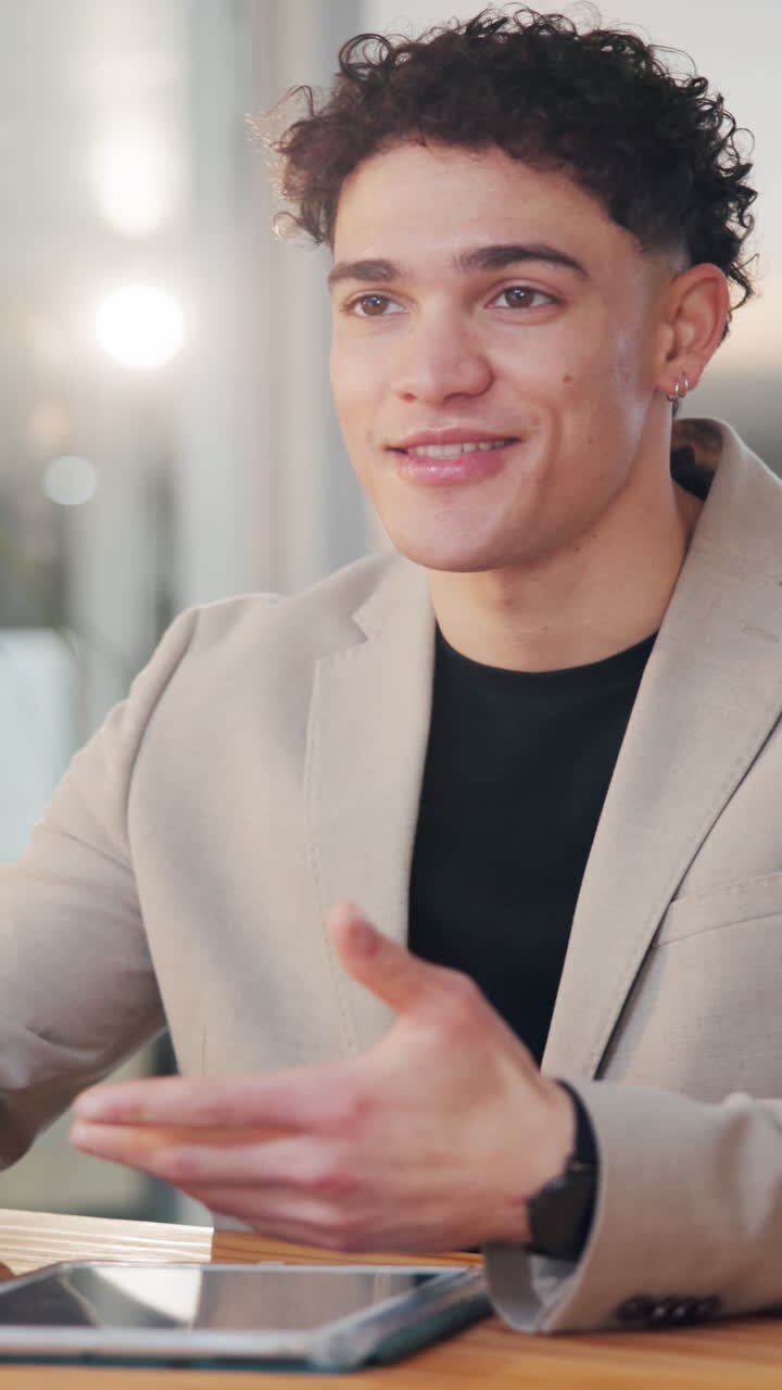 Young Man Talking and Gesturing During a Business Discussion