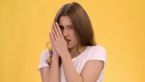 woman covering her face - fear and anxiety