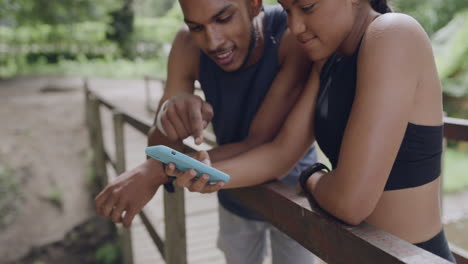 two athletes using a phone