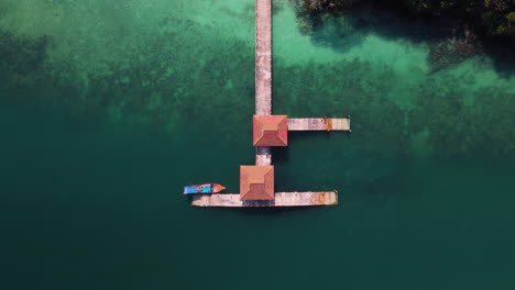 aerial view of a tropical pier and boat