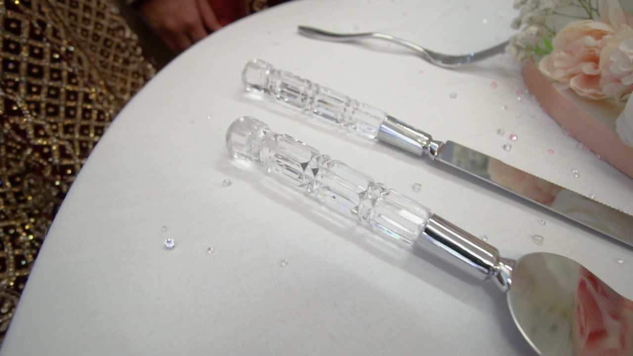 A view of beautiful knifes at the cake cutting table on a wedding