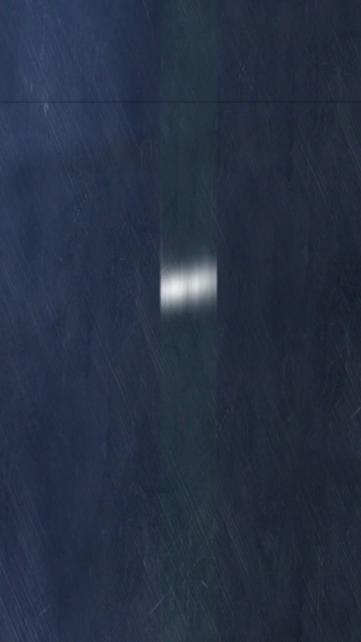 Abstract Light Streak Moving Across Dark Textured Background