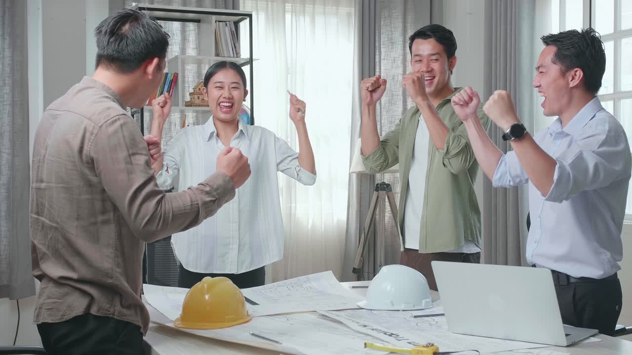 Happy Engineering Team Celebrating Project Success