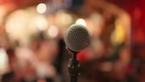 microphone on stage against a background of auditorium.
