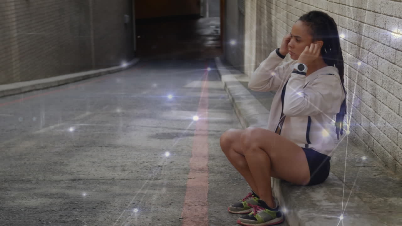 Glowing network of connections against african american fit woman wearing earphones on the street