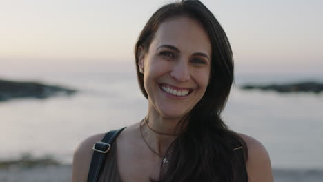 slow motion portrait of beautiful elegant woman laughing cheerful on peaceful beach seaside