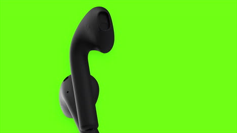 auriculares negros sobre un fondo verde