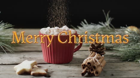 feliz texto de navidad en naranja sobre chocolate caliente con malvaviscos, galletas y palitos de canela
