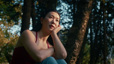 woman contemplating in a park
