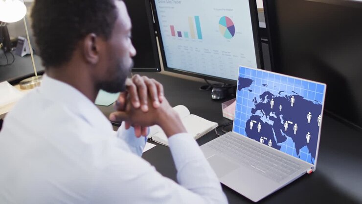 Composition of african american businessman using laptop with ai chat on screen