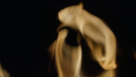 Slow-motion-shot-of-flames-and-embers-in-a-fireplace