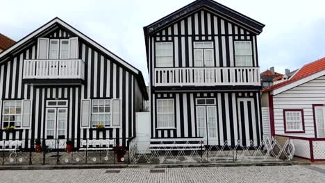 black and white striped facade walls of houses of costa nova, portugal, day