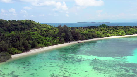 tropical island aerial view. camera flies over the shore and the beach of the tropical island
