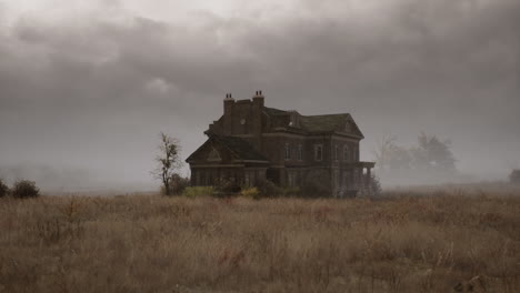 abandoned house sits alone in a foggy landscape during twilight hours