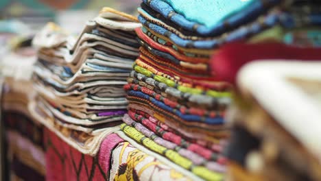 colorful stacked fabrics at a market