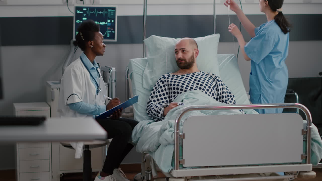 Physician doctor discussing illness treatment writing medical symptom on clipboard