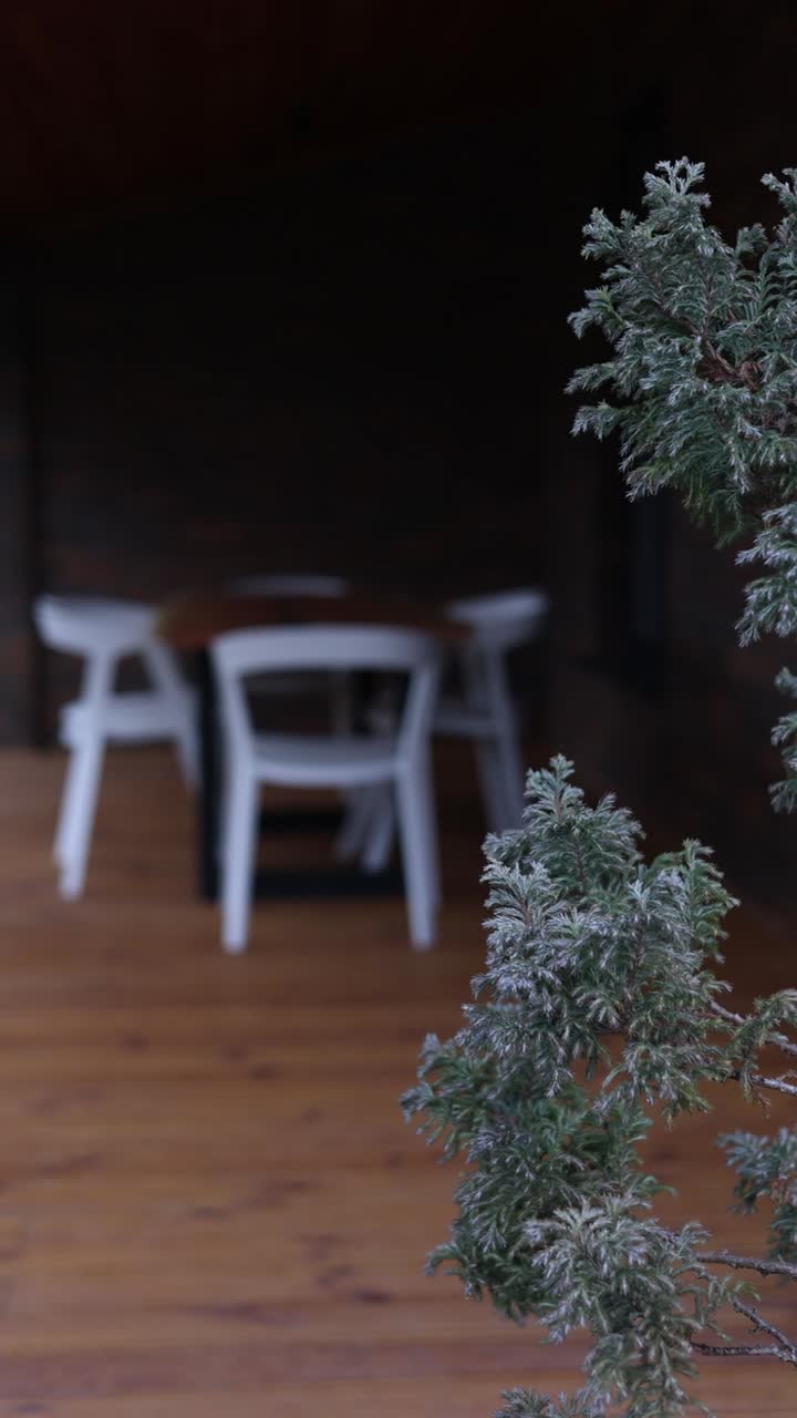 Outdoor Dining Area on a Deck with Brick Wall