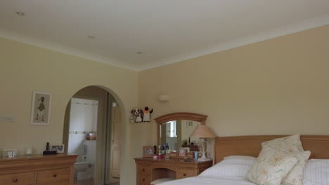 downward tilt shot of a master bedroom with en suite