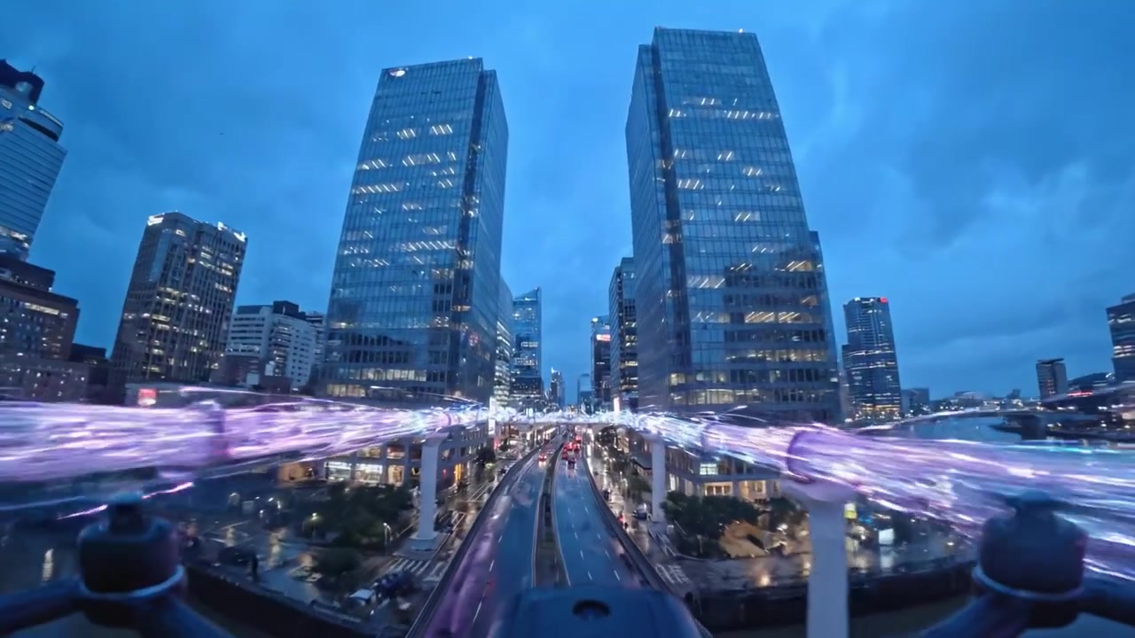 Dynamic Urban Nightscape: A Drone's Eye View of a City Hub with Rain-Drenched Streets and Vibrant Lights Reflecting the Energetic Atmosphere of Urban Life