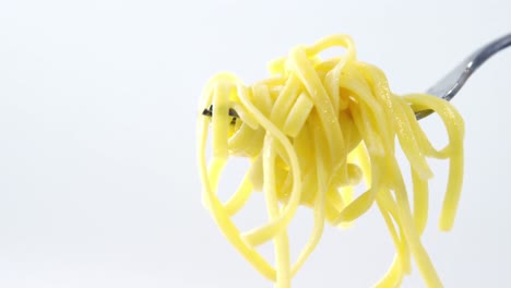 close-up of cooked pasta on fork