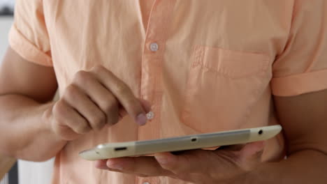 man using his tablet