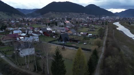 aerial-falling-away-from-a-morphing-Campulung-Moldovenesc-is-a-city-in-Suceava-County,-northeastern-Romania