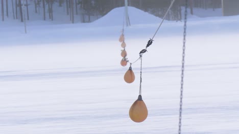 frozen dam powerplant high tide buoys hanging swinging in the wind - medium close up shot