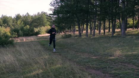 man running on a forest path