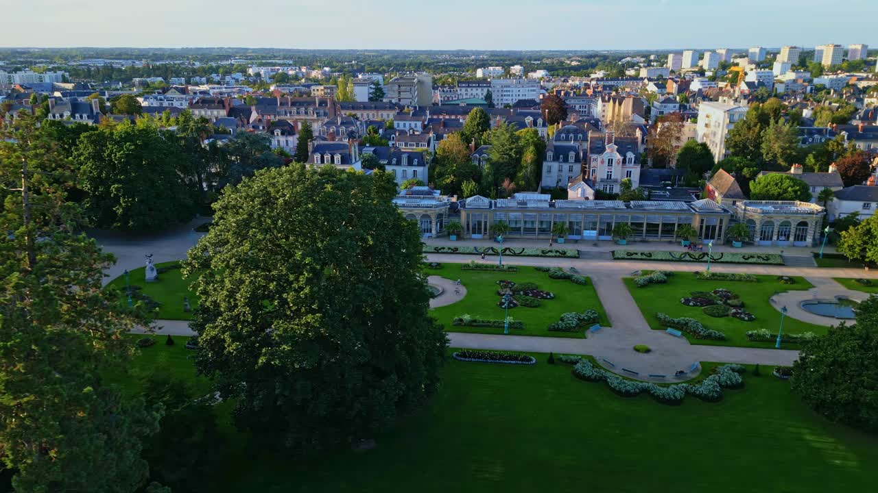 Aerial view of a city park with surrounding buildings