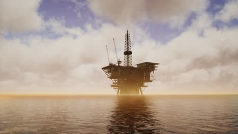 offshore jack up rig in the middle of the sea at sunset time